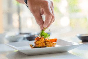 Image Chefs hand plating food